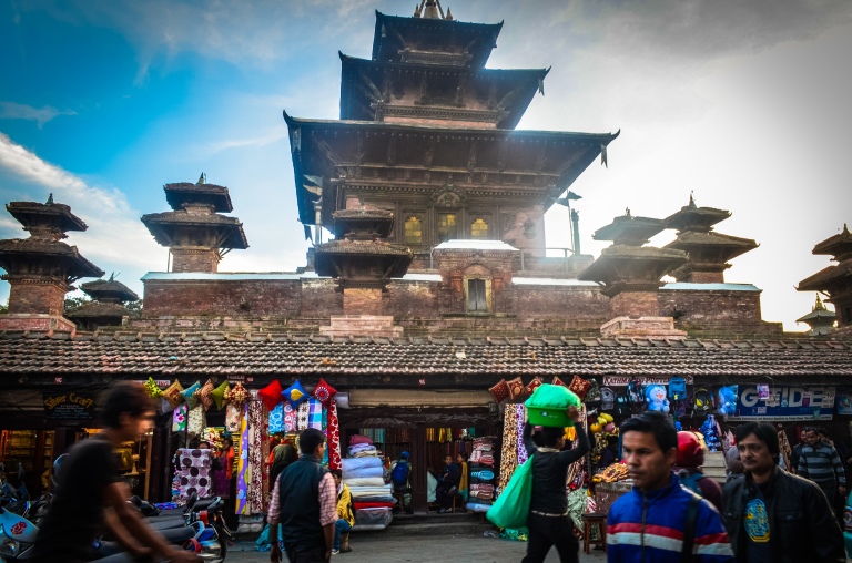 Passersby in front of a textile store outside of Durbar square.
